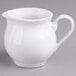 A white pitcher with a handle.