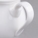 A Villeroy & Boch white porcelain creamer with a handle.