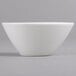 A Villeroy & Boch white porcelain bowl with a small rim on a gray surface.