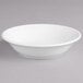 A Villeroy & Boch white porcelain bowl on a gray surface.