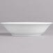 A white Villeroy & Boch Corpo porcelain bowl on a gray surface.