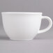 A close-up of a Villeroy & Boch white porcelain cup with a handle.