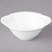 A white Villeroy & Boch porcelain soup cup on a gray surface.