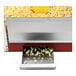 A red Paragon Theater Pop popcorn machine with popcorn in it on a counter.