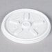 A close-up of a white plastic Dart lid with a circular hole.