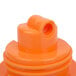 An orange plastic Choice Brew Thru lid.
