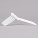 A white brush with white bristles.