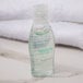 A small plastic bottle of Dial Restore body wash with clear liquid inside.