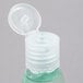 A clear plastic bottle of Dial Restore body wash with a plastic lid.