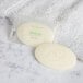 A Dial Restore Basics body bar in a plastic package on a white towel.
