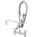 A chrome T&S deck mounted pre-rinse faucet with a silver hose attached.