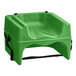A green plastic Lancaster Table & Seating booster seat with black chair straps.
