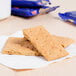 A stack of Nabisco Honey Maid graham crackers on a napkin.