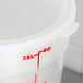 A white plastic lid for Cambro round food storage containers with red writing.