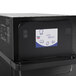 A black Merrychef eikon e2s countertop oven with a digital display.