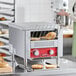 A commercial conveyor toaster with a 3-inch opening, designed for toasting bagels and bread, shown in a bakery setting.
