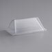 A clear plastic container on a gray surface.