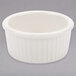 A white ceramic Tuxton fluted ramekin with a ribbed rim.