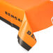 An orange and black Cincinnati Bengals table cover on a table.