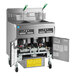 A Frymaster natural gas floor fryer system with two open fryer units.