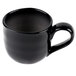 A black coffee mug with a handle.