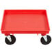 A red plastic Vollrath Traex dolly base with black wheels.
