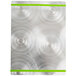 A silver Alumitique menu board with green swirls on a metal surface.