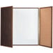 A wooden frame with a white board and cork board inside.