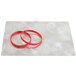 A silver surface with a pair of red rubber bands on a Menu Solutions Alumitique menu board.