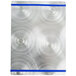 A silver rectangular Alumitique menu board with a blue swirl on a metal surface.