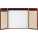 A wooden cabinet with a white rectangular markerboard with a cherry wood frame and metal corners.