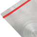 A Menu Solutions Alumitique aluminum menu board with red bands on a metal surface.