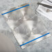 A Menu Solutions Alumitique menu board with royal blue bands on a white surface.