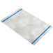 A white rectangular Alumitique menu board with blue swirls on a metal surface.
