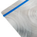 A Menu Solutions Alumitique menu board with royal blue bands on a metal surface.