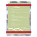A Menu Solutions Alumitique aluminum menu board with red bands and silver swirls holding a white menu card.