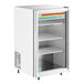 A white True countertop refrigerated merchandiser with glass doors and shelves.