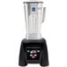 A Waring commercial blender with a silver container and lid.