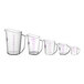 A row of Cambro purple polycarbonate measuring cups with purple writing on them.