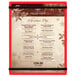 A red Menu Solutions acrylic menu board on a table.