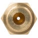 A brass hexagon with a hole in it.