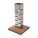 A Rosseto stainless steel multi-level riser with a walnut base.