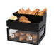 A black container with food on a tray in a bakery display.