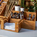A wooden box with Rosseto Natura bamboo flatware and utensils.