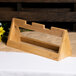 A Rosseto natural bamboo tray riser on a table.