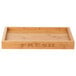 A natural bamboo tray with the word "FRESH" on it.