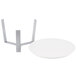 A white plate with a metal stand on it.