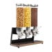 A white Rosseto triple cereal dispenser with containers of cereal and nuts.