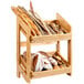 A Rosseto natural bamboo display stand with bread and pastries on wooden shelves.