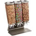 A Rosseto triple cereal dispenser on a counter filled with different cereals.